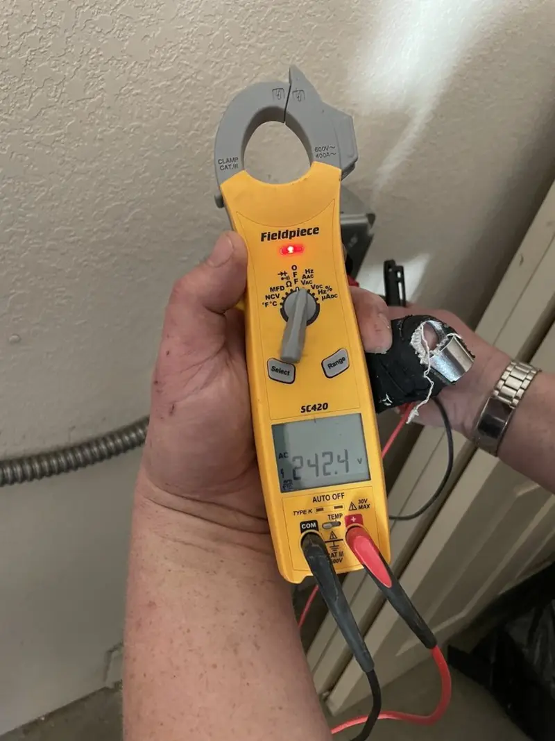 Voltage testing with clamp meter during Recessed Lighting Installation in Preston